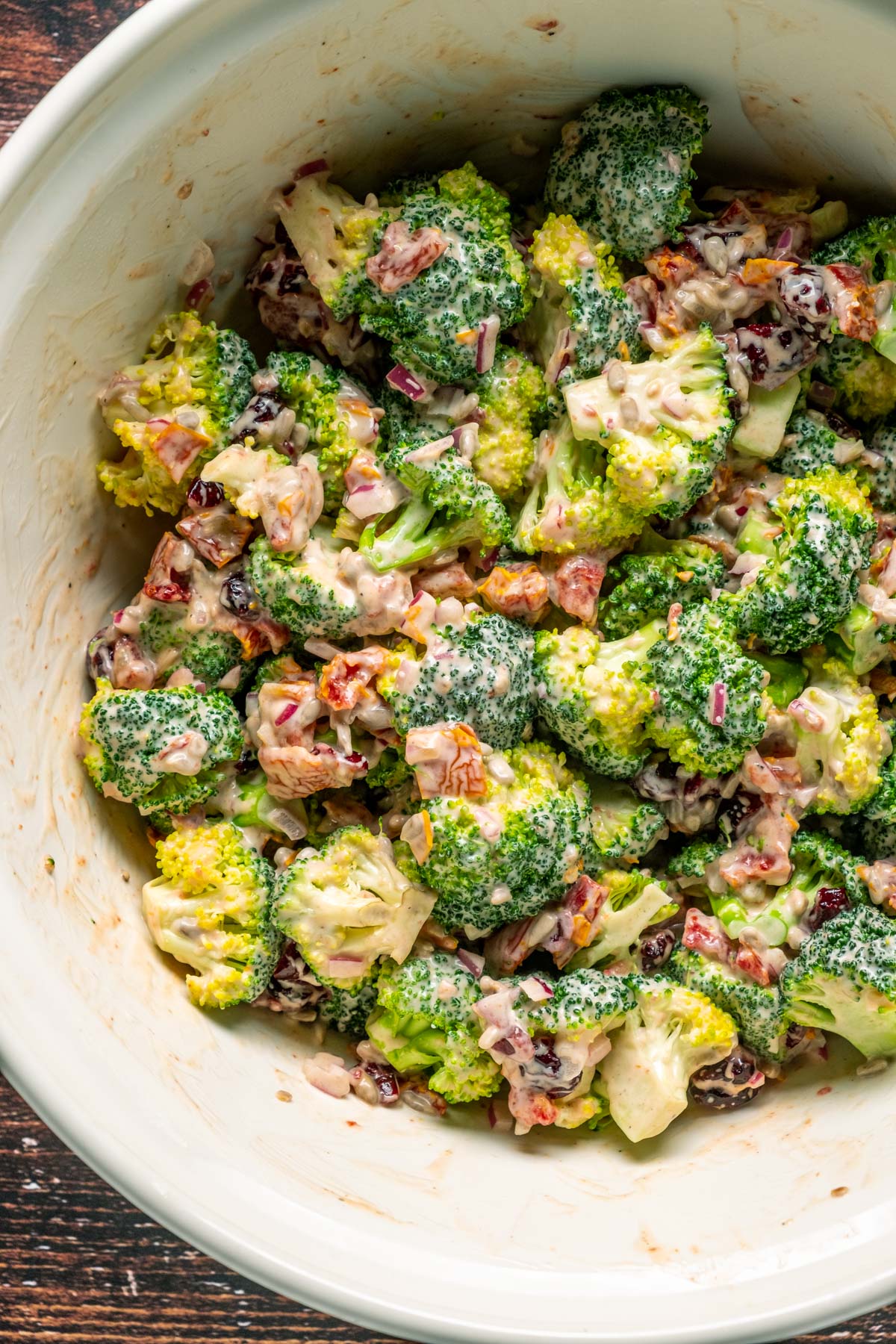 Vegan broccoli salad in a mixing bowl.