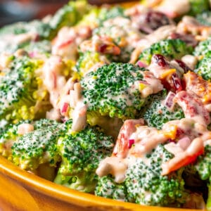 Vegan broccoli salad in a wooden salad bowl.
