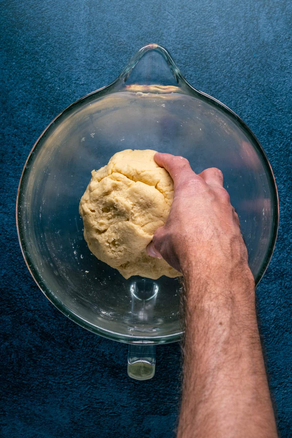 Mixing biscotti dough in a mixing bowl.