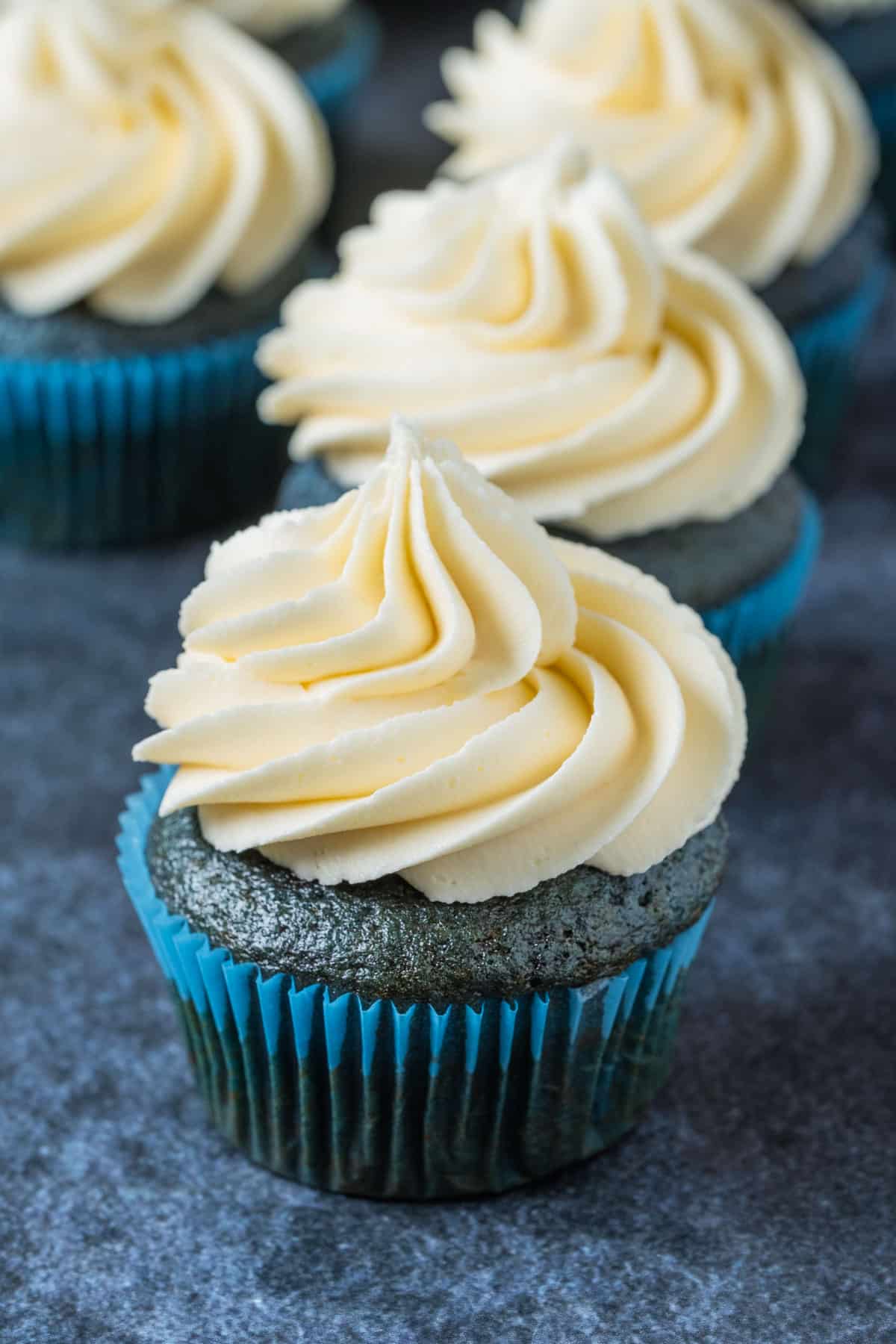 Vegan blue velvet cupcakes topped with a tangy vegan buttercream.