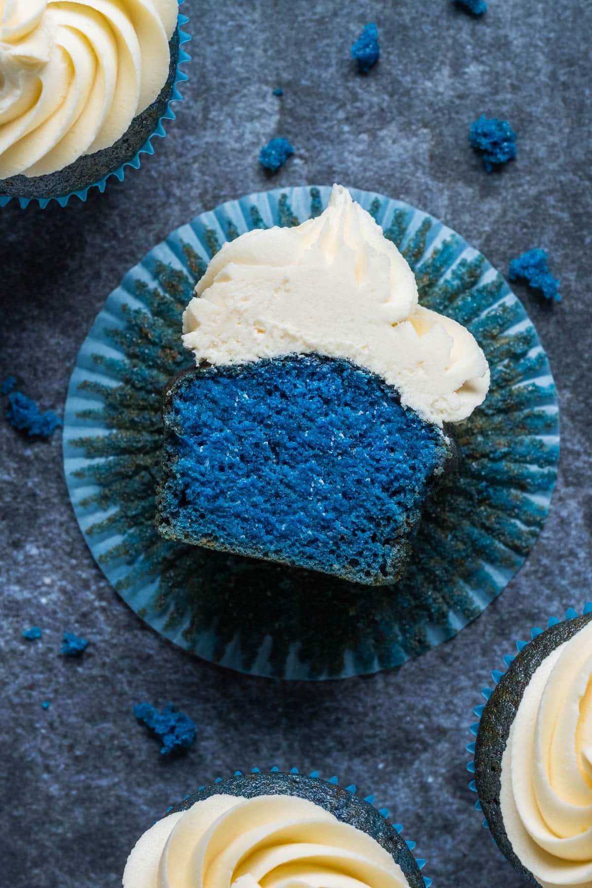 Vegan blue velvet cupcake cut in half.