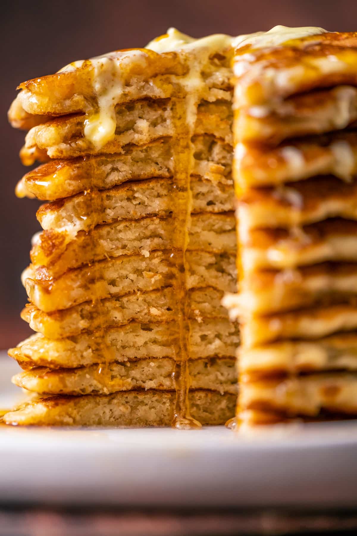 Stack of vegan oatmeal pancakes with a section cut out.