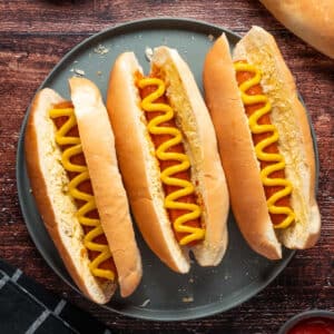 Carrot dogs on a gray plate.