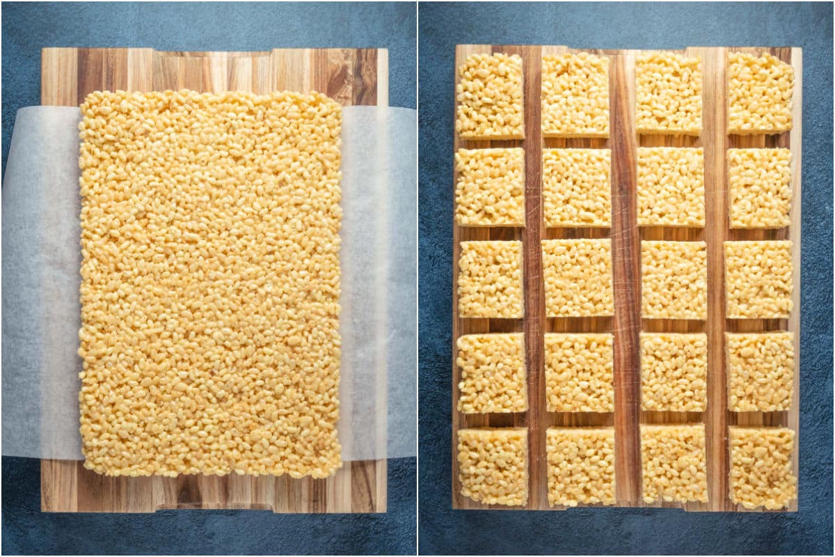 Rice krispie treats lifted out of the dish with the parchment paper overhang and cut into squares.