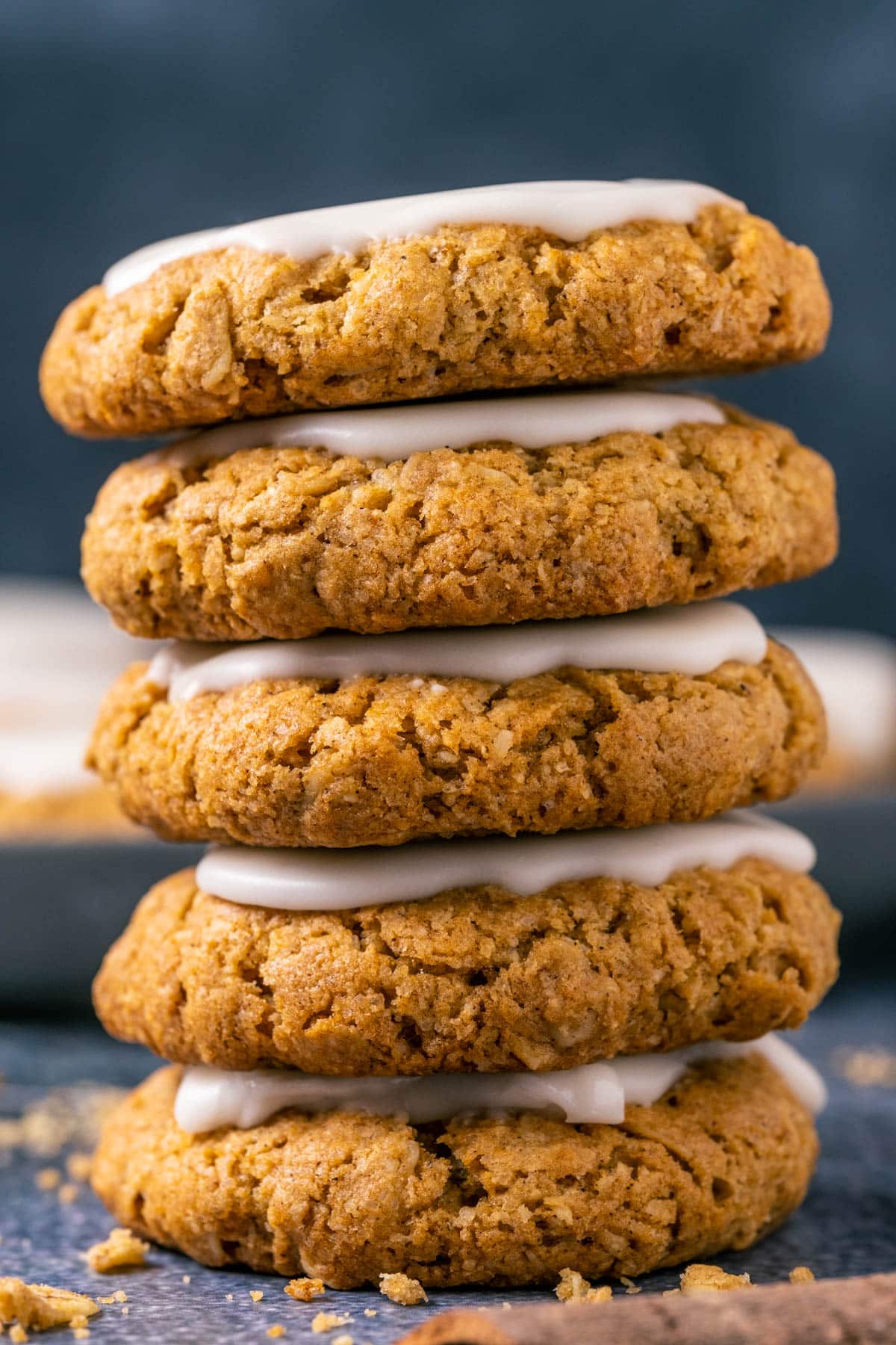 Frosted oatmeal cookies in a stack.