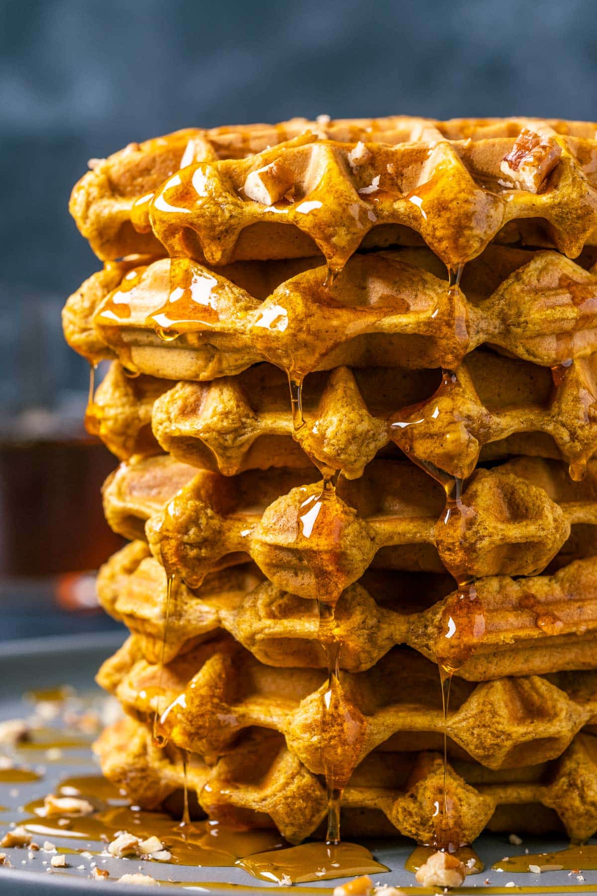 Stack of waffles on a gray plate.